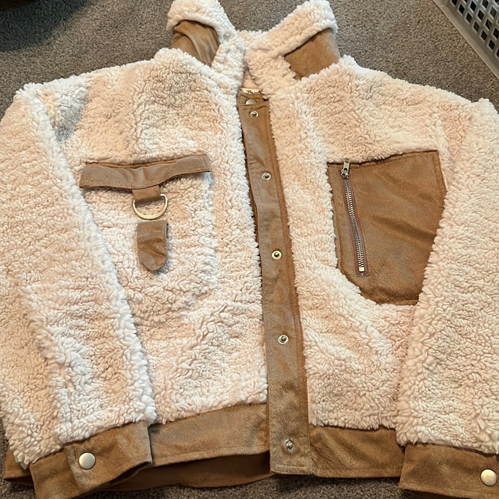 Lyn Burches white and brown furry jacket